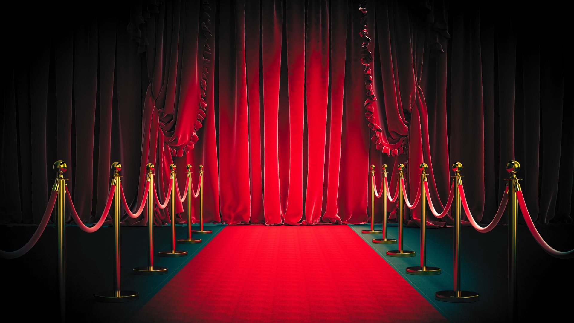 Red carpet with curtains and rope barriers